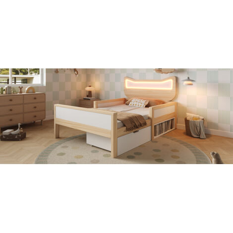 Ce lit bébé de 90 x 190 cm est doté d'un haut en forme d'oreilles de chat et de lumières LED RGB. Il comprend un sommier à lattes en bois et des tiroirs réglables. Matelas non inclus. (1/5)