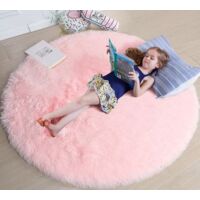 pink round rug, measuring 1.2 meters by 1.2 meters, is suitable for a girl's bedroom. A soft, round rug is ideal for a children's room.