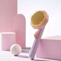 Self-cleaning pet comb, pumpkin grooming comb for dogs, cats, and rabbits, easy care comb in purple.