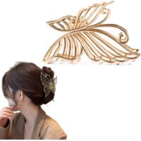 Large gold-plated metal claw hair clip for women, featuring an elegant butterfly design. Durable and volumizing hair accessory with strong hold, suitable for everyday use.