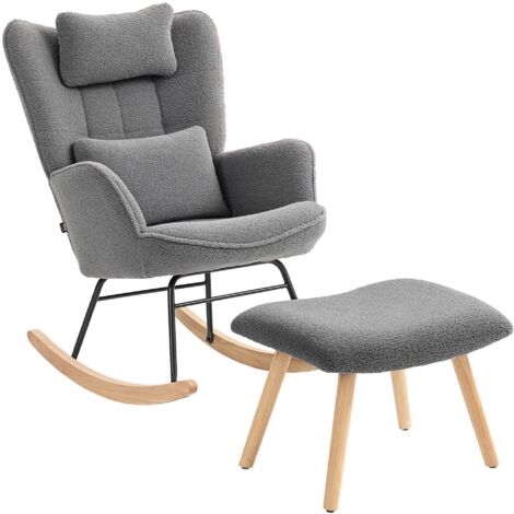 Un fauteuil à bascule avec repose-pieds, revêtement d'assise en laine douce, pieds en bois, coussins, dossier haut et couleur gris foncé. (1/5)