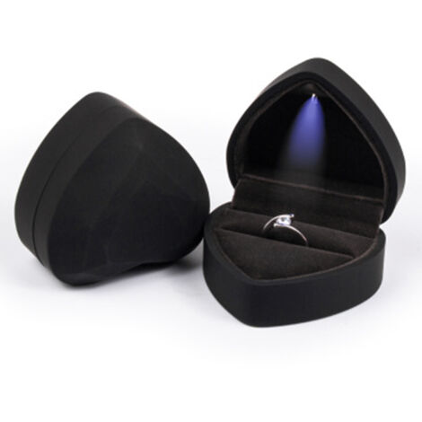 Heart-shaped jewelry box with velvet lining and integrated LED, for rings and earrings.