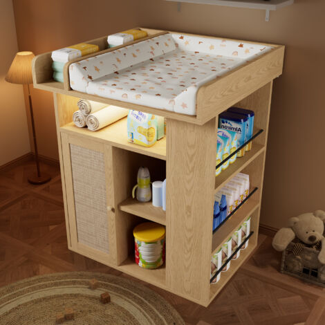 Table à langer bois tons naturels éclairage LED réglable,vaste rangement latéral et espace aménagé avec cloisons.