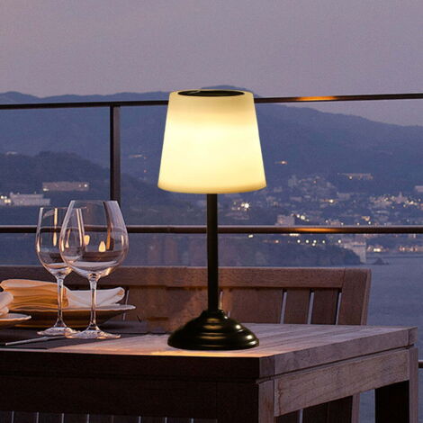 Lámpara de mesa solar recargable para exteriores, ideal para patios, terrazas, jardines y mesas. Resistente al agua (IP65), sensor de luz automático, base de plástico y metal.
