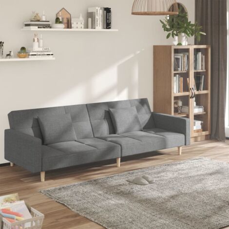 Sofa-Bett für 2 Personen mit zwei hellgrauen Kissen aus Stoff