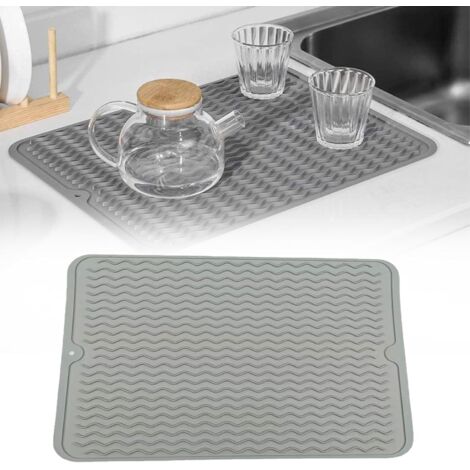 Alfombrilla de silicona antideslizante y resistente al calor para encimeras de cocina, color gris claro.