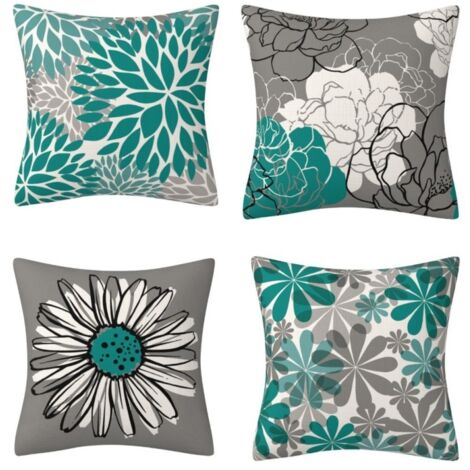 Un juego de cuatro fundas de almohada turquesas y grises adornadas con un moderno estampado de manzanilla y delicados motivos florales, adecuadas para sofás, salas de estar, dormitorios, jardines y es