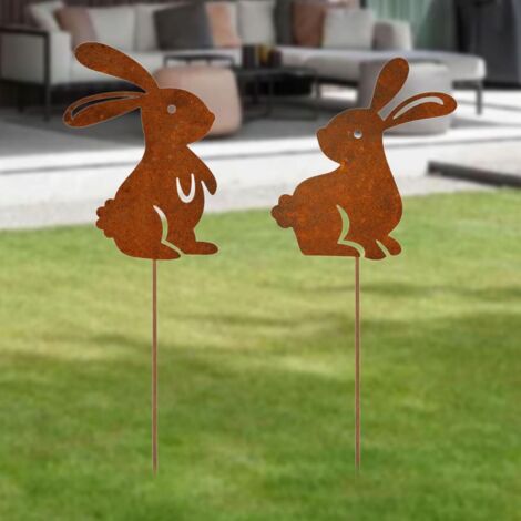 Dos conejos, adornos de jardín con pátina verdosa, perfectos para Pascua y decoración de exteriores.