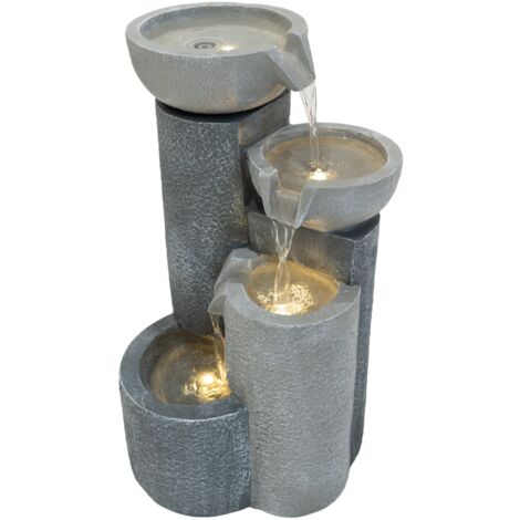 Fuente de agua eléctrica "TRANQUIL TIERS"  Poliresina durable  Diseño con 3 cuencos en cascada  56x33x32 cm  LED blanco cálido  Bomba silenciosa  Cable 7 m   Cepillo incluido  Gris