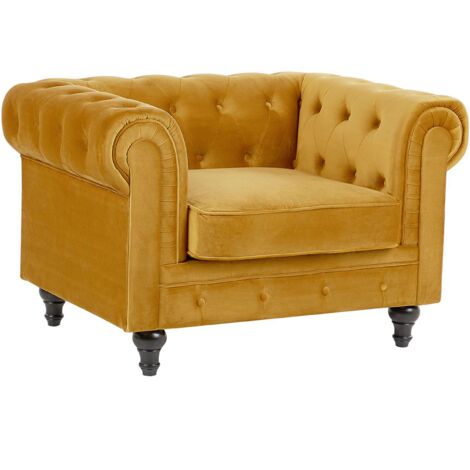 Sillón Chesterfield tapizado en tela de terciopelo amarillo patas de madera oscura estilo contemporáneo Chesterfield