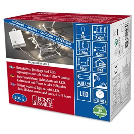 Konstsmide 3722-103 - Catena luminosa LED con interruttore e sensore, timer per 6 e 9 ore, adatta a esterni (IP44), 20 diodi a luce bianca calda, funzionamento a batteria, con cavo trasparente, scatol