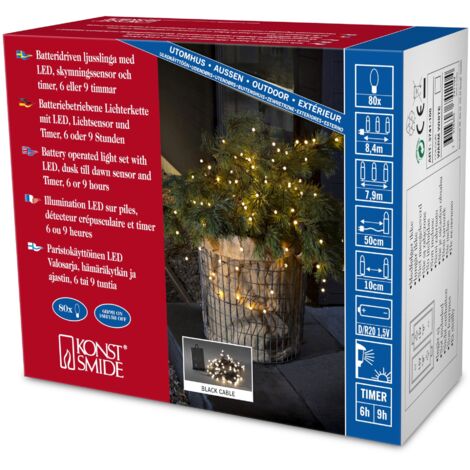 Konstsmide 3741-100 - Catena luminosa LED, diodi rotondi, con interruttore on/off e sensore luminoso, timer per 6 e 9 ore, adatta a esterni (IP44), 80 diodi a luce bianca calda, funzionamento a batter