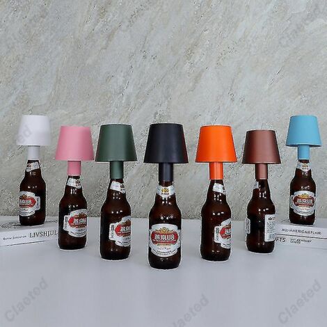 Lampe de table LED amovible et rechargeable par USB, idéale pour créer une ambiance chaleureuse dans un bar ou un café.