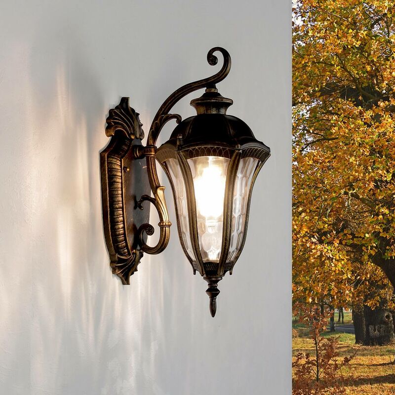Image of Licht-erlebnisse - Lanterna da parete per esterni Lampada da parete ocn braccio in stile rustico color oro anticato impermeabile IP44 per balcone