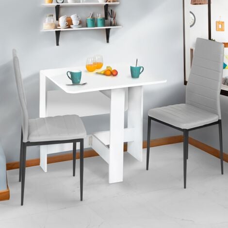 Mesa plegable de comedor con sillas dentro Mesas de segunda mano