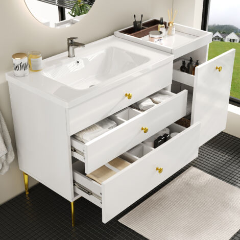 Meuble salle de bain blanc et or équipé lavabo céramique,tiroirs et espaces de rangement. Mobilier design moderne pour aménagement salle d’eau.