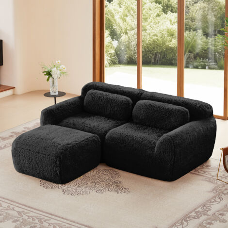 Modulares 2-Sitzer-Sofa in L-Form mit geschwungener Rückenlehne und Chaiselongue, bezogen mit Plüschstoff, geeignet für 2 bis 4 Personen, schwarz.