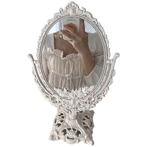 Petit miroir ovale à rabat sculpté, idéal pour les outils de maquillage et la chambre à coucher. Miroir en verre sur pied.