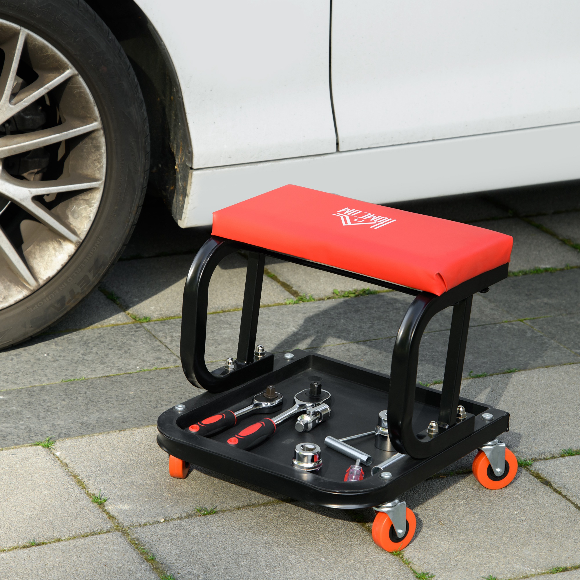 Tabouret d'atelier mobile à roulettes en acier, assise rembourrée similicuir, plateau à outils, charge 100 kg, rouge