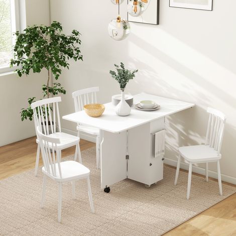 Table pliante à abattants avec étagères à 3 niveaux. Coffre de rangement et roulettes. En MDF. 130 x 80 x 76,5 cm. Blanche. (1/5)