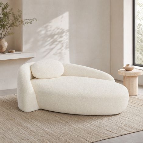 Canapé beige en tissu  avec design arrondi et coussin d’appui-tête (1/5)