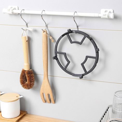Support pour wok antidérapant, stable et pratique en fonte, idéal pour la cuisine. (1/5)