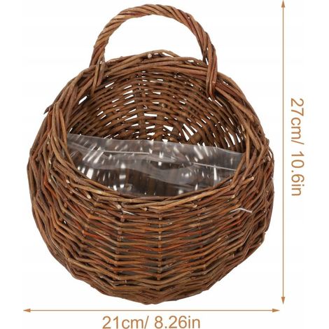 Ein Hängekorb aus Rattan, geeignet für Küche und Blumendekoration.