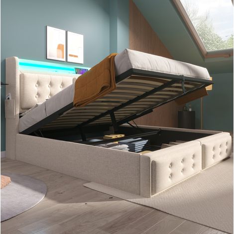 Lit rembourré 140x200 cm moderne avec tête de lit USB-C et prises, LED, coffre relevable, beige, bois et métal (1/5)