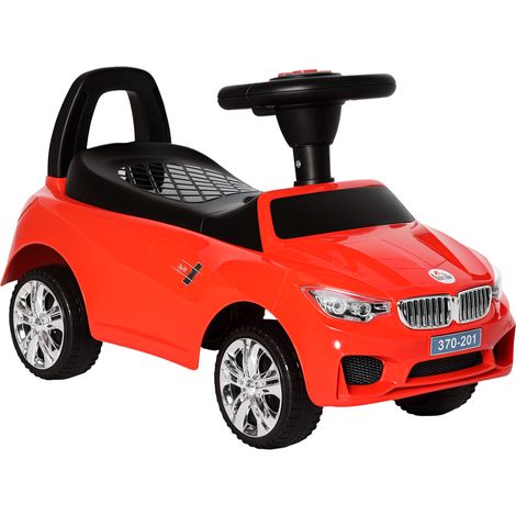 Voiture rouge électrique pour enfant avec phares, musique, klaxon, volant, rangement et poignée pour 18 à 36 mois, design sportif pour extérieur pratique et sécurisé