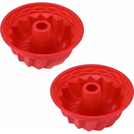 Deux moules à gâteaux,en silicone rouge,peuvent résister à des températures allant jusqu'à environ 250 degrés Celsius. (1/5)