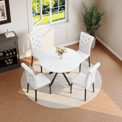 Ensemble table ronde imitation marbre et 2 chaises blanches. Chaises en simili cuir à coutures boutonnées et pieds métalliques pour cuisine. (1/5)