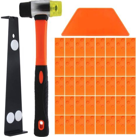 Kit de pose pour parquet stratifié. Ce kit comprend 40 cales d'espacement, une tige de traction robuste et un marteau en fibre de verre à manche souple et antidérapant. (1/5)