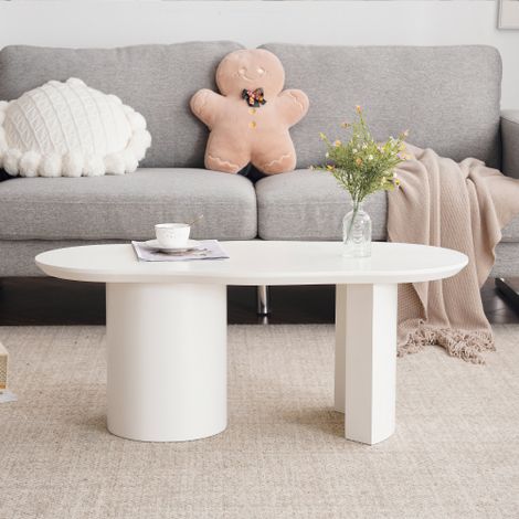 Table basse longue, blanche et aux formes irrégulières, à la fois robuste et durable — en MDF de haute qualité, finition laquée, toucher lisse, avec un plateau aux courbes élégantes et asymétriques. (1/5)