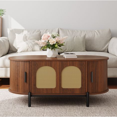Tavolino ovale in MDF effetto legno noce, ante in rattan, piedini metallici neri (1/5)