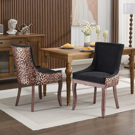 Chaises de salle à manger : revêtues d'un tissu épais, dotées de pieds en bois massif aux tons neutres et rehaussées de rivets couleur bronze. Lot de 2 style imprimé léopard. (1/5)