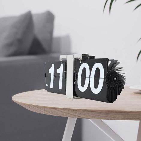 Reloj mecánico retro giratorio – Caja de PVC y acero inoxidable, funciona con pilas, diseño minimalista en negro para oficina/sala de estar. (1/5)
