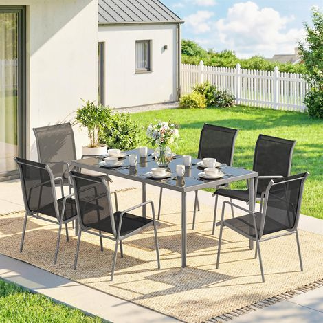 Ensemble extérieur 7 pièces : 6 chaises texteline empilables + table basse plateau verre noir/argenté