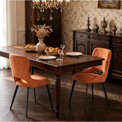 Sedia da pranzo in ciniglia arancione con struttura in metallo, schienale traspirante e seduta imbottita (1/5)