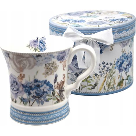 Elegante taza de porcelana con diseño de hortensias azules y empaque decorativo. (1/4)