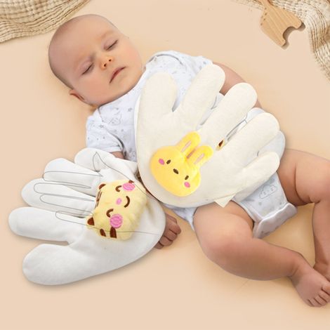 Coussin apaisant pour bébé aux graines de cassia, qui prévient les réactions de sursaut  doux, multifonctionnel et sans danger pour les bébés, avec une forme de lapin pour la main gauche. (1/5)