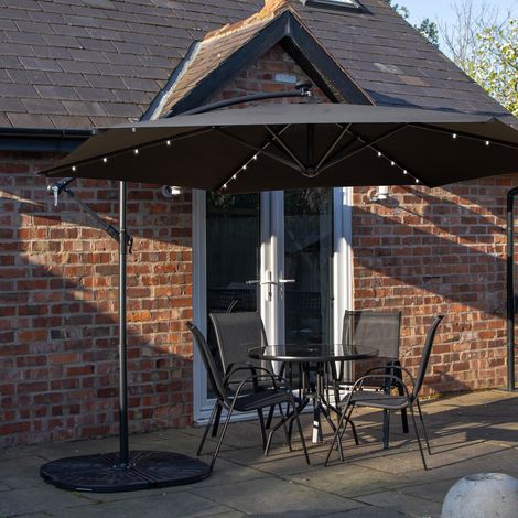 Outdoor 4 Person Round Glass Top Garden Dining Table Chairs With Black Banana Lit Parasol and Base (1/5)