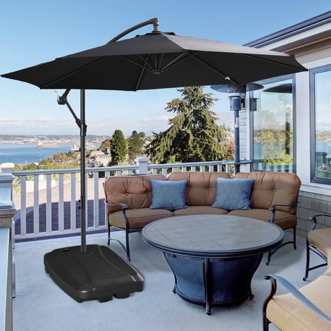 Pied de parasol de jardin en PEHD avec base en T et roulettes. Pied de parasol déporté lestable jusqu'à 75 kg avec de l'eau et du sable. 80 x 60 x 17 cm. Noir.