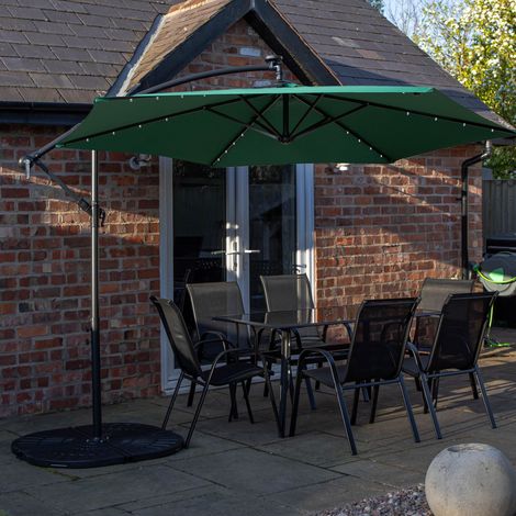 Outdoor 6 Person Rectangular Glass Top Garden Dining Table Chairs With Green Banana Lit Parasol and Base (1/5)