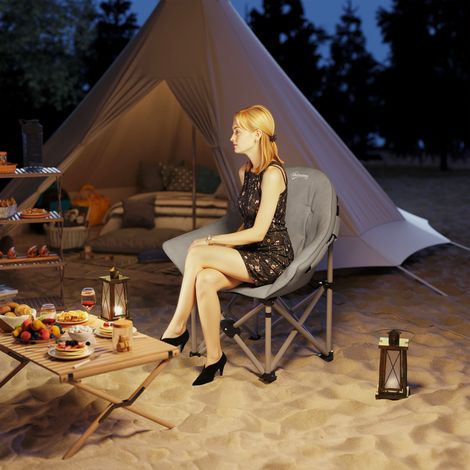Silla de camping plegable, portátil y ligera, con asiento acolchado, bolsillos laterales y bolsa de transporte, color gris oscuro.