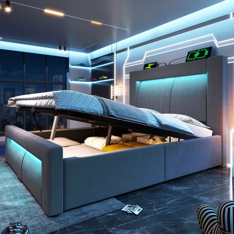 Bett 90x200 cm aus grauem Samt, hydraulischer Stauraum, LED, USB und geschwungenem Kopfteil (1/5)