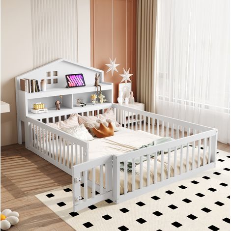 Cama infantil de madera maciza blanca 140x200 cm con somier, barrera de seguridad, puerta y almacenaje (1/5)