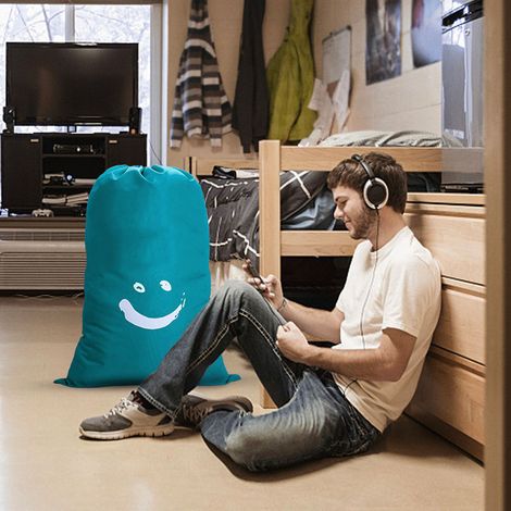 Sac à linge cylindrique en nylon avec cordon de serrage (61 x 92 cm), idéal pour ranger vêtements, vêtements de voyage, couettes ou livres. Motif smiley bleu. (1/5)