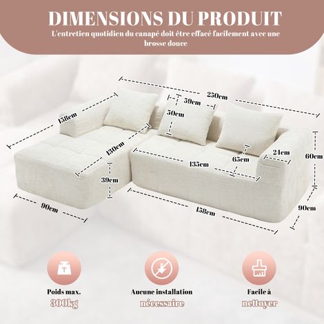 Canapé moderne en tissu, modèle L-Sofa. Il s’agit d’un canapé avec trois sièges. Trois coussins sont inclus. Une poche latérale permet de ranger la télécommande. Couleur beige. (1/5)