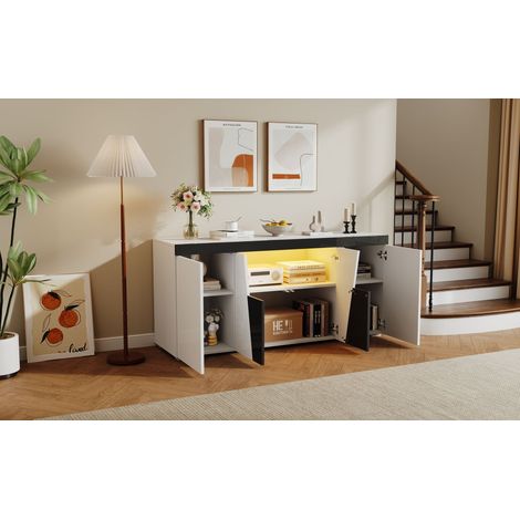 140 x 40 x 65 cm. Meuble de salon. Grande armoire à rangement, avec 3 compartiments et 4 portes. Design angulaire. Couleur noir-blanc. Meuble moderne, équipé d’un éclairage LED. (1/5)