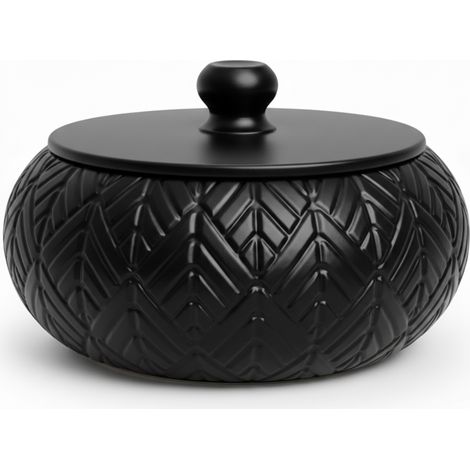 Scatola portagioie nera con coperchio decorativo per la toeletta.